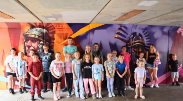 Mark Shields with some of the young people whose ideas inspired the design
