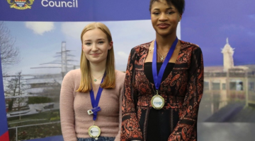 Young Mayor and Member of Youth Parliament standing side by side